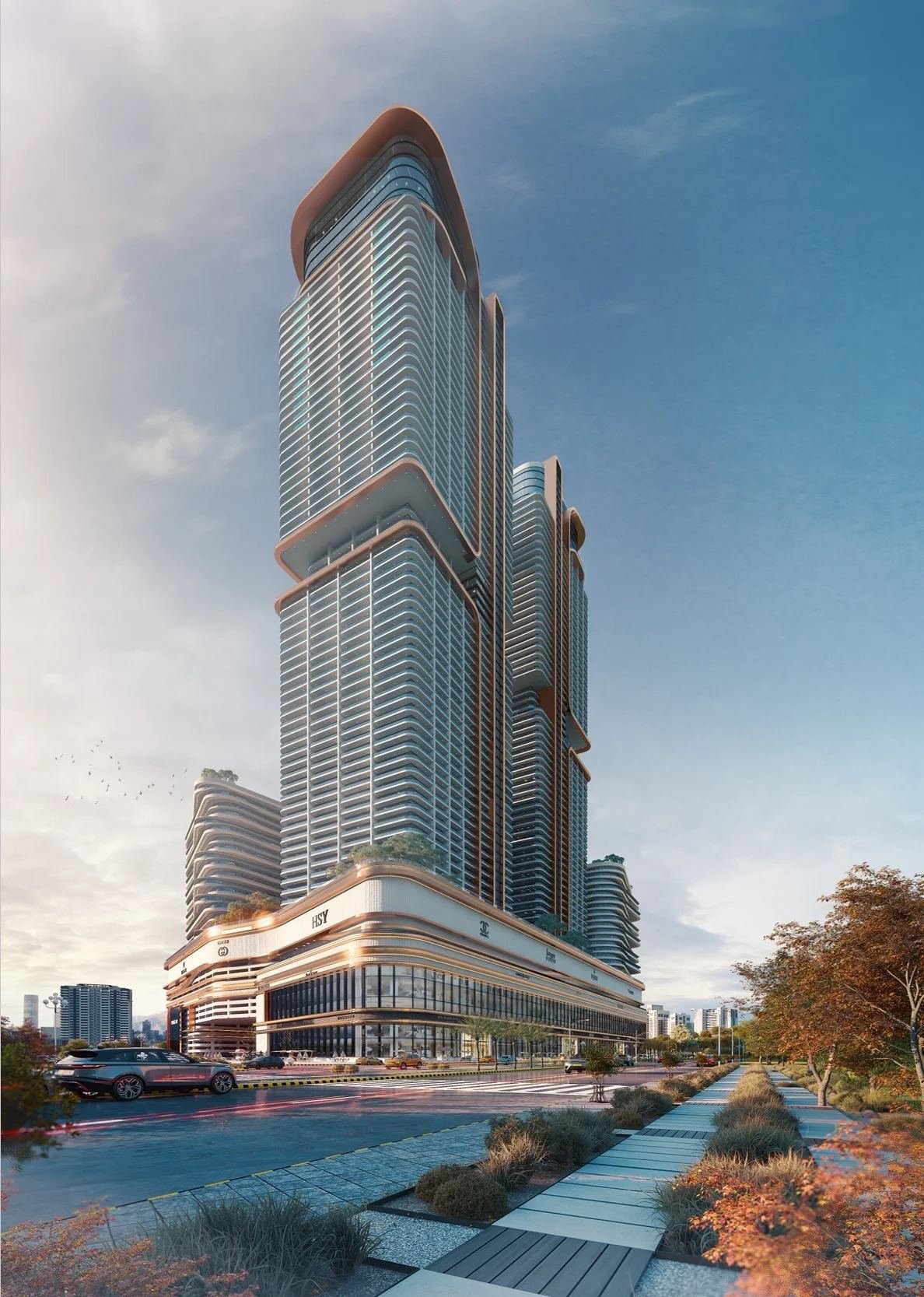 Burj Quaid daytime street view with HSY and Gucci flagship retail at podium level